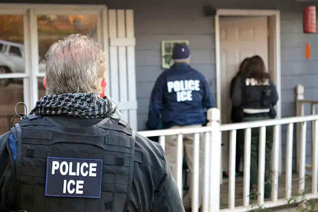 ICE agents at a home in Atlanta during a targeted enforcement operation in 2017